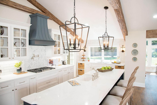 a farmhouse kitchen with faux beams