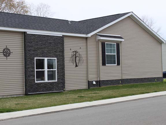Modernizing a mobile home with faux stacked stone siding panels